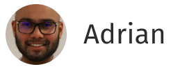Portrait of a man with glasses and a beard smiling, next to the name Adrian.