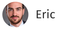 Headshot of a man with dark hair, beard, and mustache wearing a suit and tie, next to the name Eric.