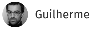 Profile photo of a man with glasses and short hair next to the name Guilherme on a rounded white background.