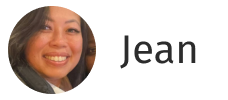 Smiling woman with long dark hair in a circular frame next to the name Jean.