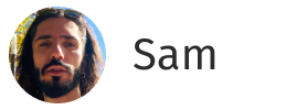 Profile photo of a man with long dark hair and beard wearing sunglasses on his head next to the name Sam.